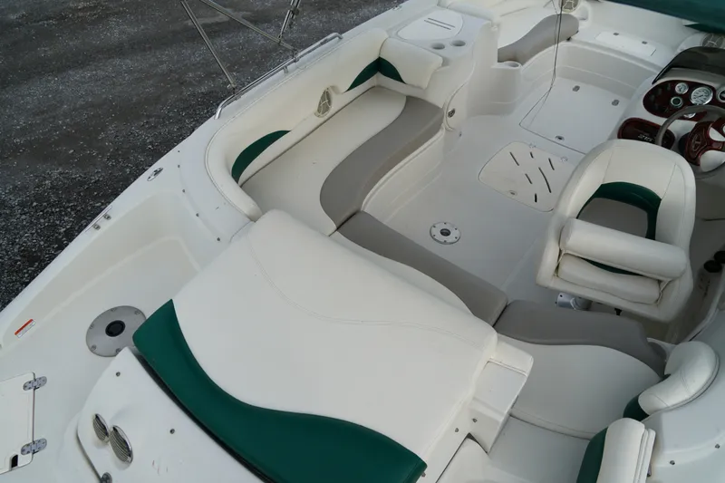 Slide: The Image of 2007 Tahoe 215 I/O boat interior with white and green seating, spacious layout. - 13