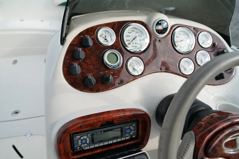 Slide: The Image of Dashboard of a 2007 Tahoe 215 I/O boat with gauges and controls. - 17