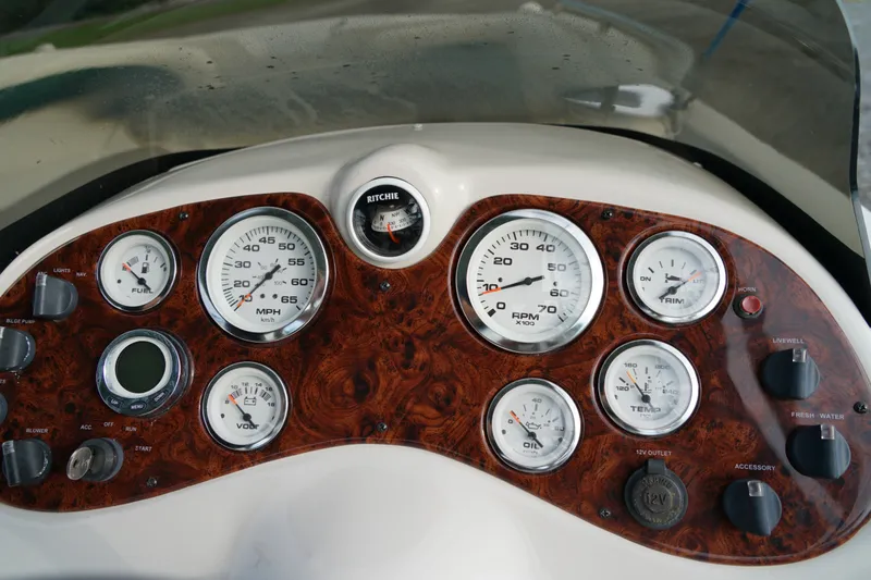Slide: The Image of Dashboard of a 2007 Tahoe 215 I/O boat with gauges and controls. - 18