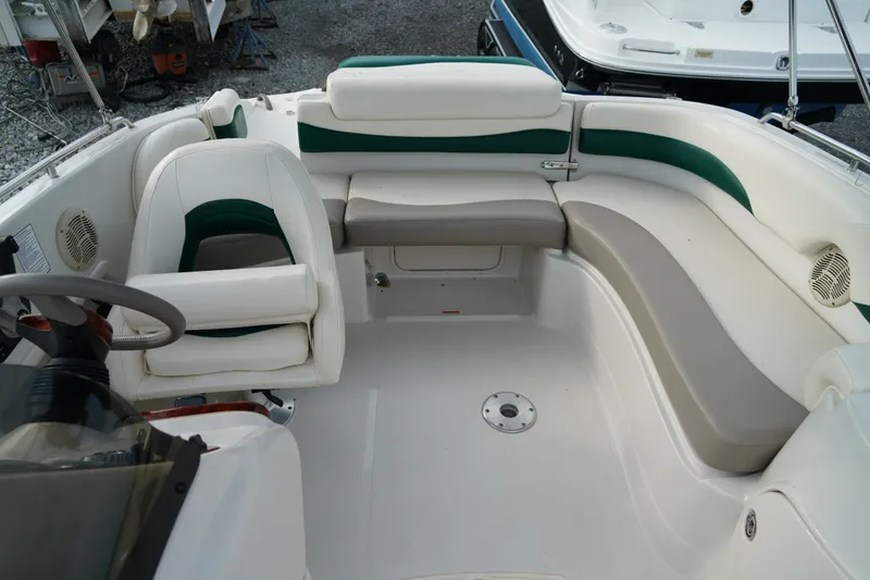 Slide: The Image of 2007 Tahoe 215 I/O boat interior with white and green seating arrangement. - 15