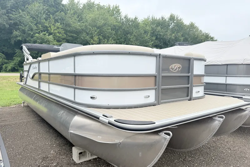 The Image of 2027 Bentley Pontoons Legacy 243 Nav Ext pontoon boat on display outdoors. - 0