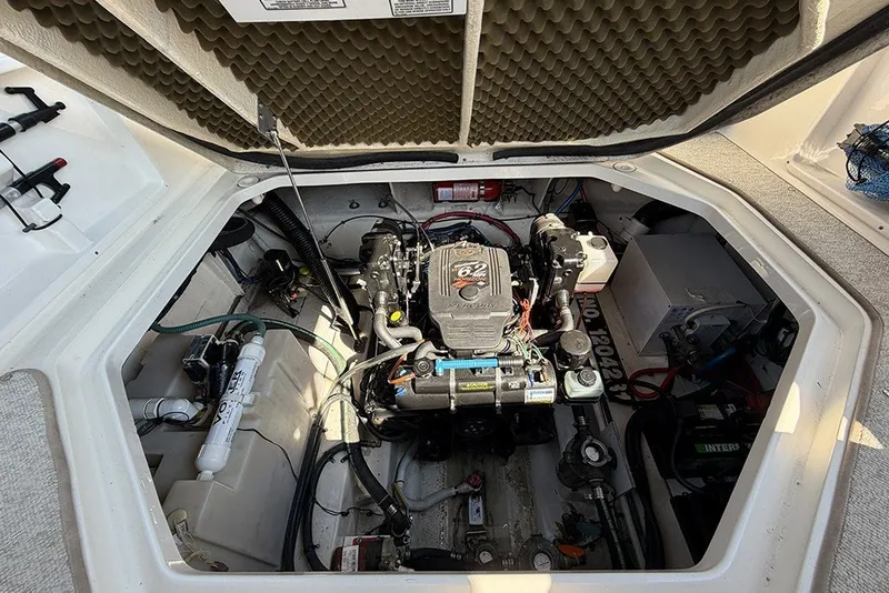 Slide: The Image of Engine compartment of a 2006 Sea Ray 270 Amberjack boat, showcasing the engine and components. - 7
