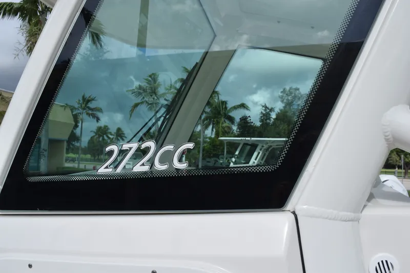 Slide: The Image of Close-up of 2027 Sailfish 272 CC boat window with palm trees reflected. - 16