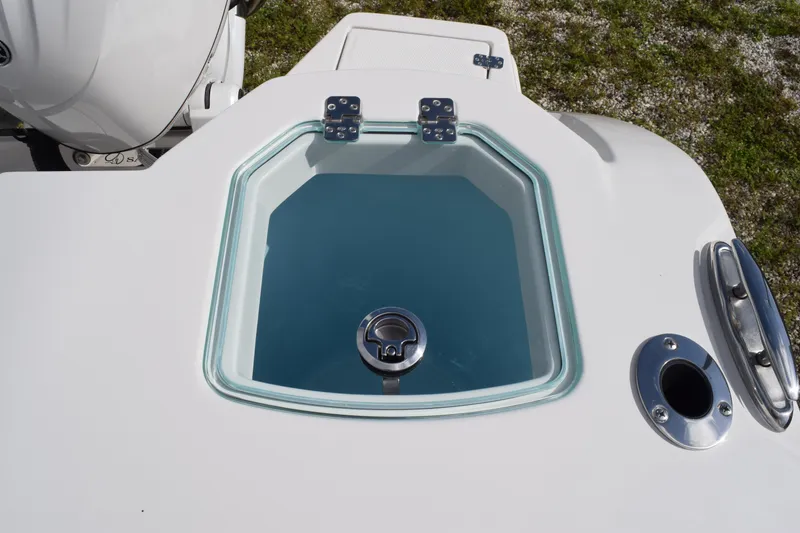 Slide: The Image of Livewell on 2027 Sailfish 272 CC boat, featuring a clear lid and stainless steel fittings. - 20