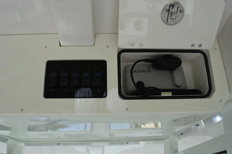 Slide: The Image of 2027 Sailfish 272 CC boat console with Garmin device and control panel. - 19