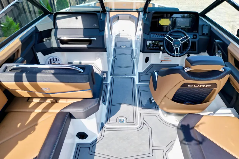 Slide: The Image of Interior of 2022 Cobalt R4 Surf boat with modern dashboard and seating. - 17