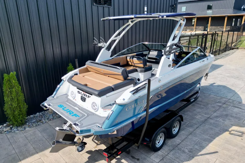Slide: The Image of 2022 Cobalt R4 Surf boat on trailer, featuring sleek design and modern amenities. - 19