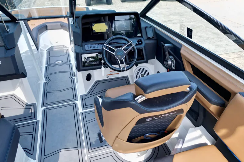 Slide: The Image of 2022 Cobalt R4 Surf boat interior with modern dashboard and steering wheel. - 16