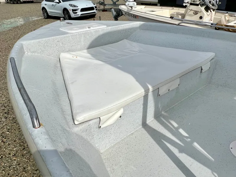 Slide: The Image of The image shows the bow area of a 2009 Pro-Line Pro-Lite 17 CC boat. - 22