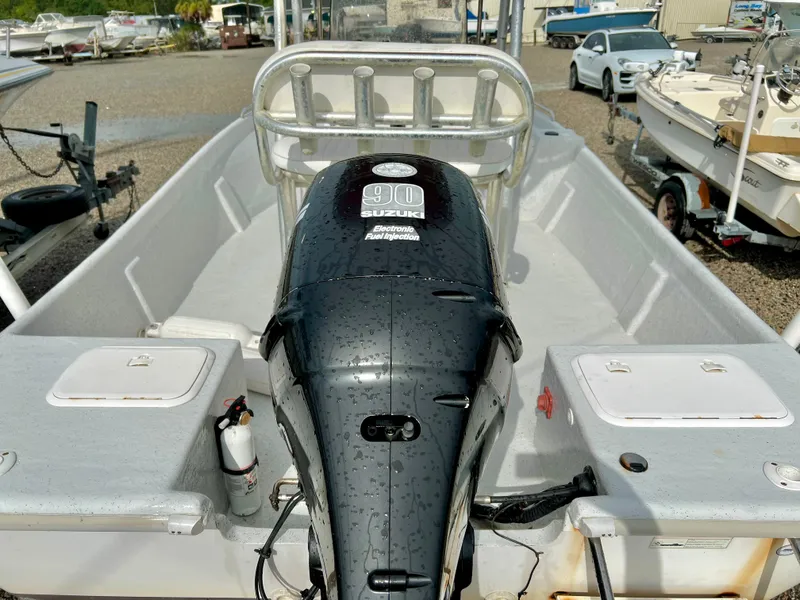 Slide: The Image of The image shows a 2009 Pro-Line Pro-Lite 17 CC boat with a Suzuki 90 HP outboard motor. - 10