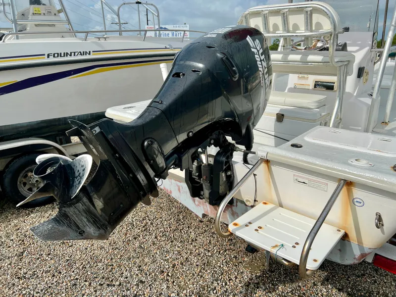 Slide: The Image of A 2009 Pro-Line Pro-Lite 17 CC with an outboard motor and swim platform. - 9