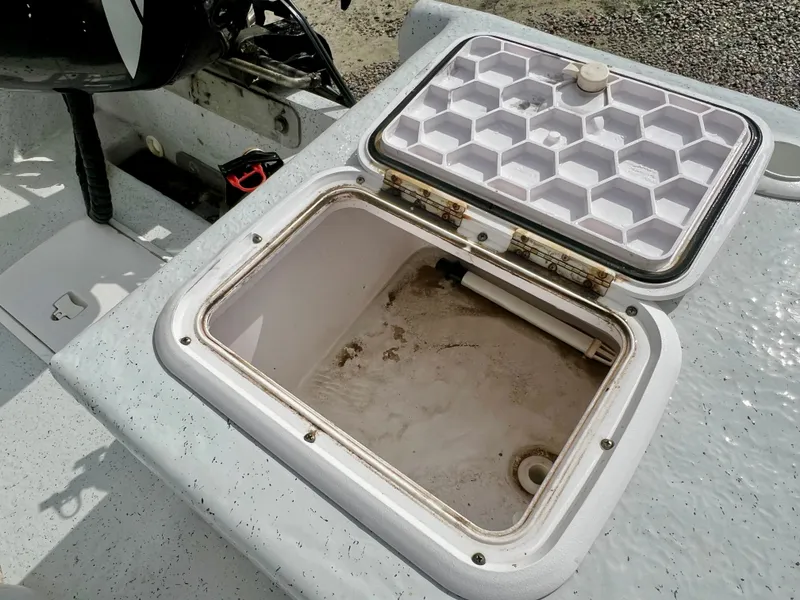 Slide: The Image of Open storage compartment on a 2009 Pro-Line Pro-Lite 17 CC boat. - 15