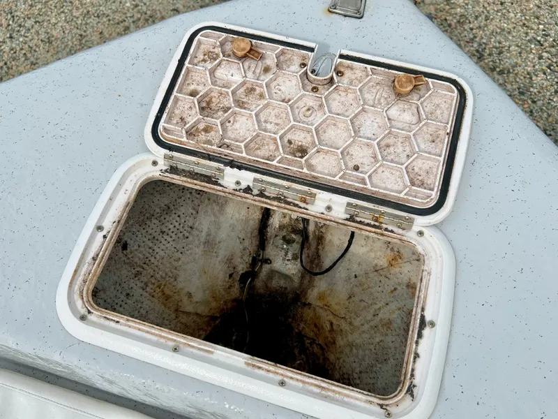 Slide: The Image of An open storage compartment on a 2009 Pro-Line Pro-Lite 17 CC boat. - 29