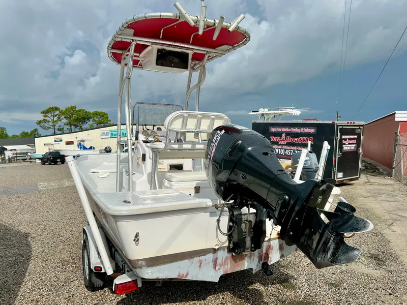 Slide: The Image of 2009 Pro-Line Pro-Lite 17 CC with outboard motor on a trailer, ready for the water. - 12