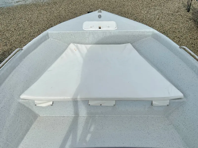 Slide: The Image of Bow of a 2009 Pro-Line Pro-Lite 17 CC with white cushion and gravel background. - 25