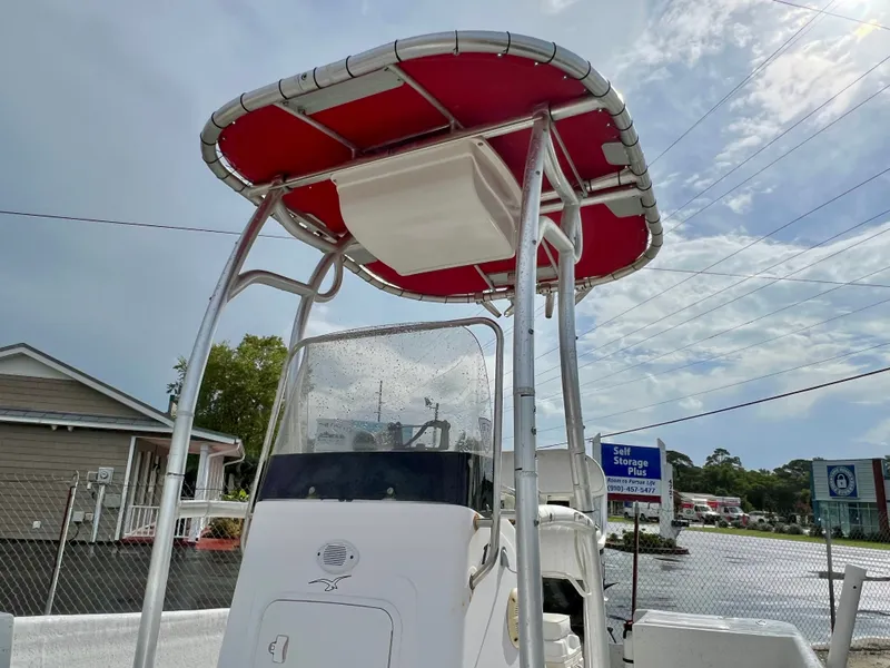 Slide: The Image of A 2009 Pro-Line Pro-Lite 17 CC with a red sunshade and white console. - 28