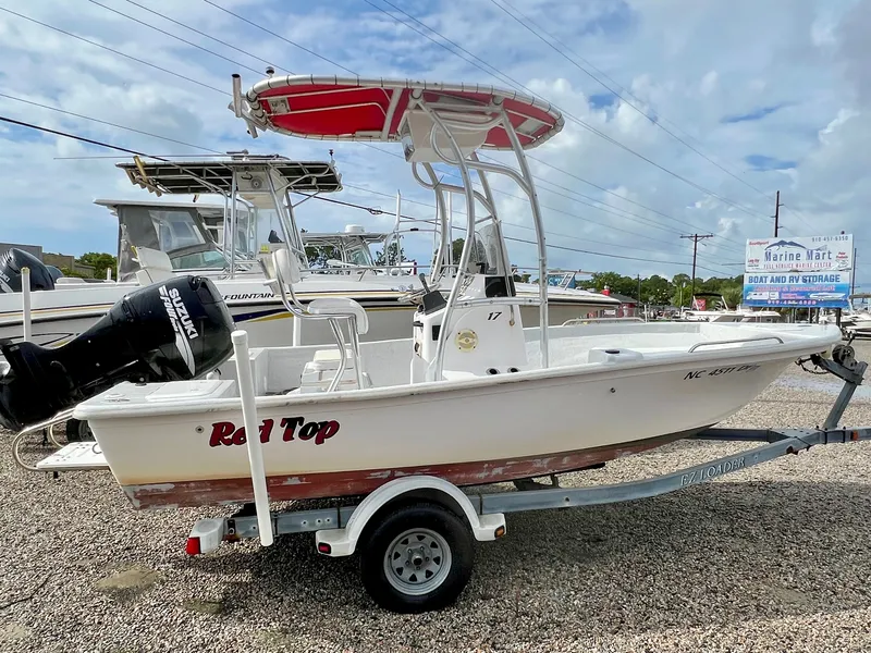 Slide: The Image of 2009 Pro-Line Pro-Lite 17 CC with red T-top and outboard motor. - 4