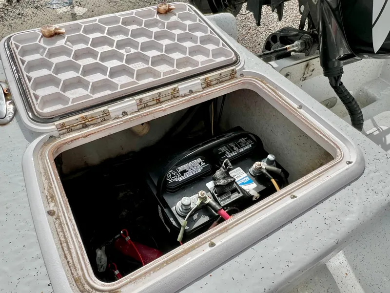 Slide: The Image of Battery compartment of a 2009 Pro-Line Pro-Lite 17 CC with open hatch. - 17