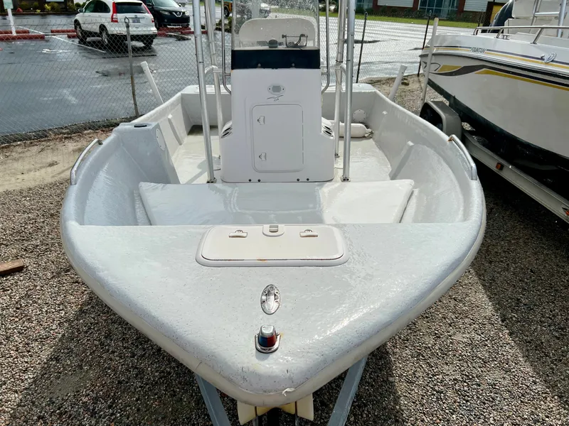 Slide: The Image of 2009 Pro-Line Pro-Lite 17 CC with center console, parked on a gravel lot. - 7