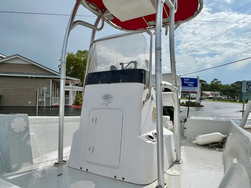 Slide: The Image of 2009 Pro-Line Pro-Lite 17 CC with T-top and helm console, parked outdoors. - 30