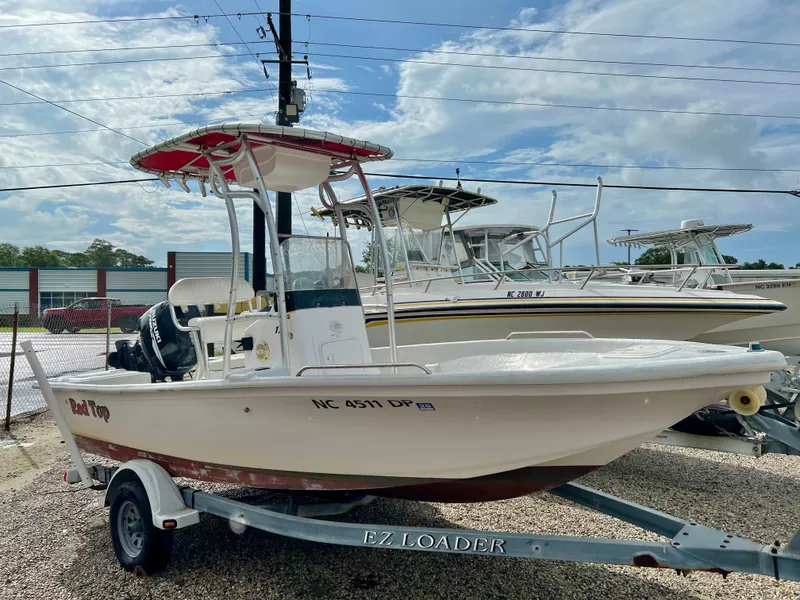 Slide: The Image of 2009 Pro-Line Pro-Lite 17 CC on a trailer, featuring a T-top and outboard motor. - 3