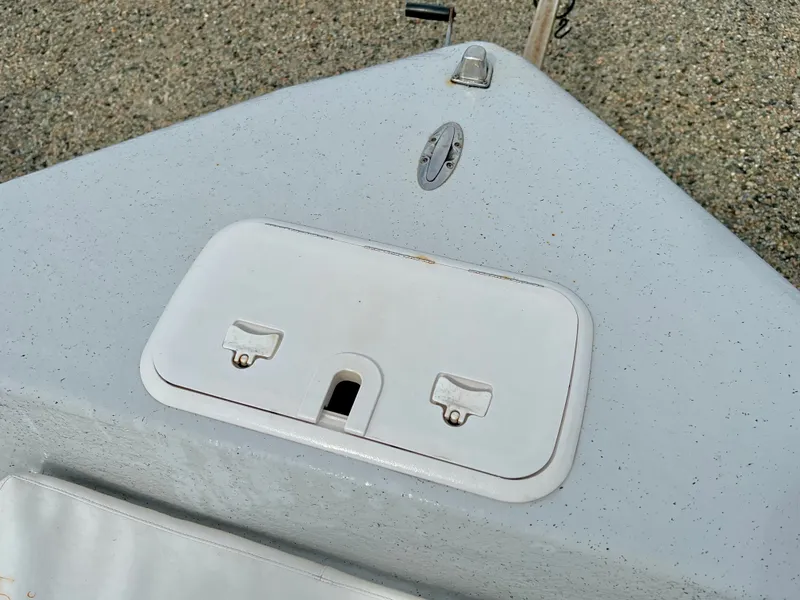 Slide: The Image of Close-up of the bow of a 2009 Pro-Line Pro-Lite 17 CC boat with storage compartment. - 27
