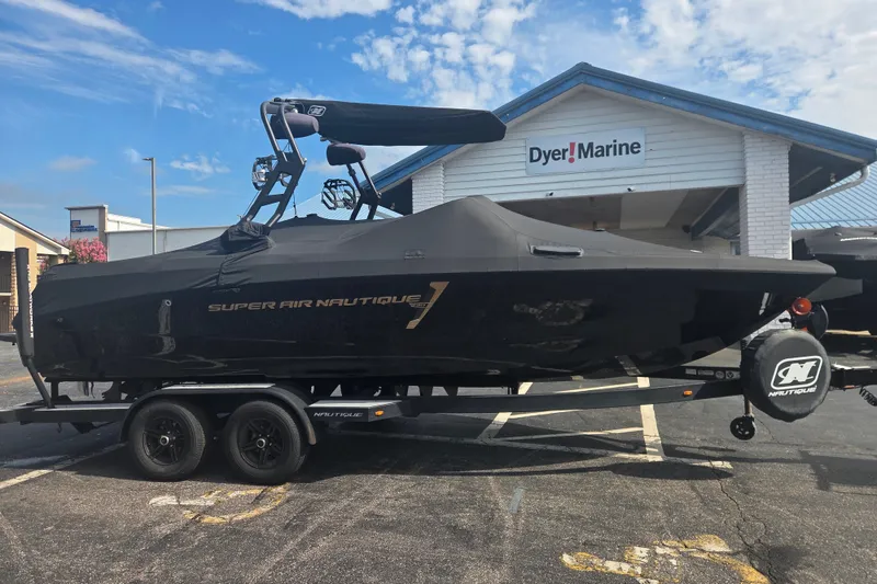 The Image of 2021 Nautique Super Air Nautique 230 boat on trailer at Dyer Marine dealership. - 0