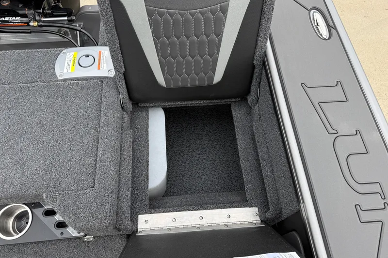 Slide: The Image of Interior view of 2027 Lund 1975 Pro-V boat, featuring storage compartment and seating. - 39