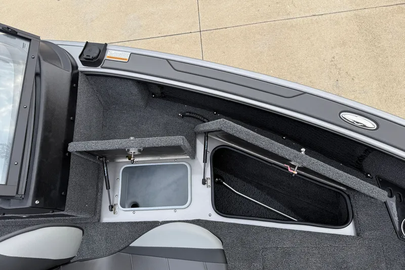 Slide: The Image of Interior view of 2027 Lund 1975 Pro-V boat with open storage compartments. - 13