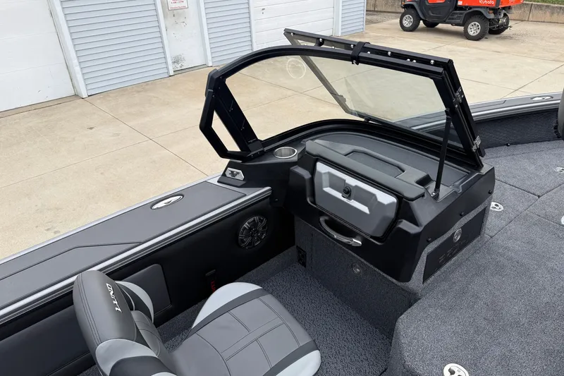 Slide: The Image of Interior of a 2027 Lund 1975 Pro-V boat, featuring seating and storage compartments. - 28