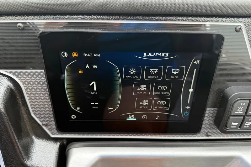 Slide: The Image of Touchscreen display of 2027 Lund 1975 Pro-V boat showing navigation and control settings. - 24