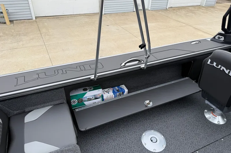 Slide: The Image of Interior of 2027 Lund 1975 Pro-V boat with storage compartment and seating. - 34