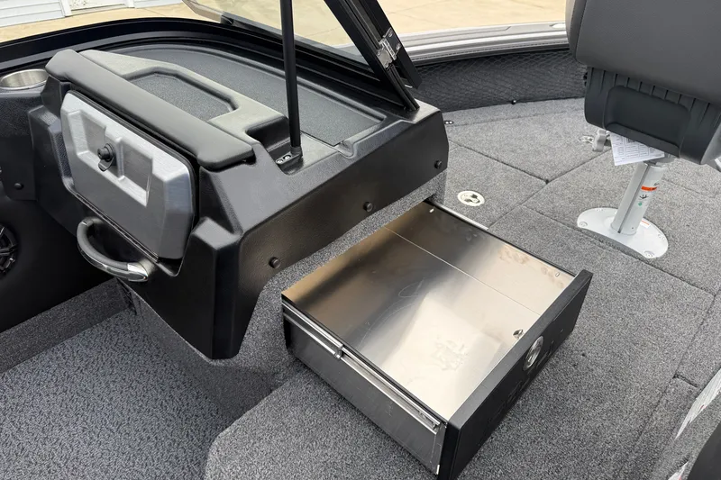 Slide: The Image of Interior of 2027 Lund 1975 Pro-V boat with open storage compartment and seating. - 17