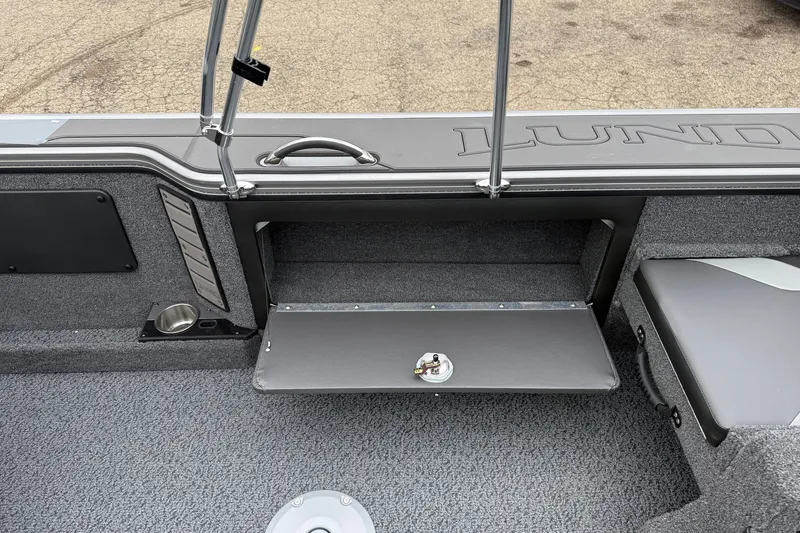 Slide: The Image of Interior of 2027 Lund 1975 Pro-V boat with storage compartment and seating. - 32