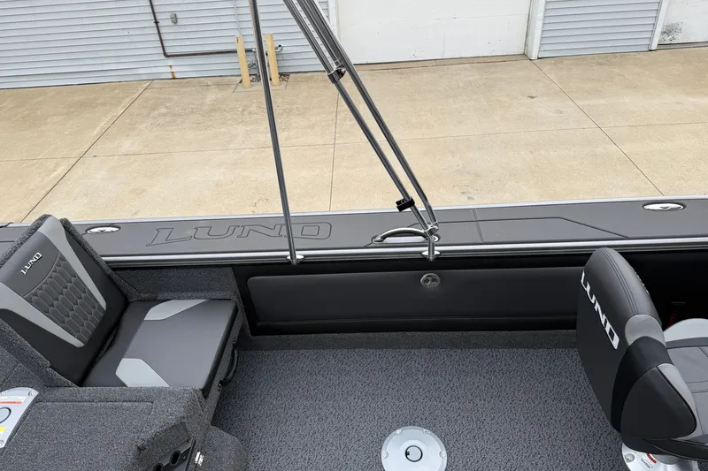 Slide: The Image of 2027 Lund 1975 Pro-V boat interior with branded seating and sleek design. - 33