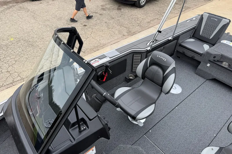 Slide: The Image of 2027 Lund 1975 Pro-V boat interior with sleek seating and modern dashboard design. - 20