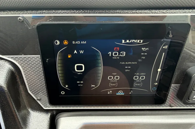 Slide: The Image of Dashboard display of 2027 Lund 1975 Pro-V boat showing speed, voltage, and fuel metrics. - 25