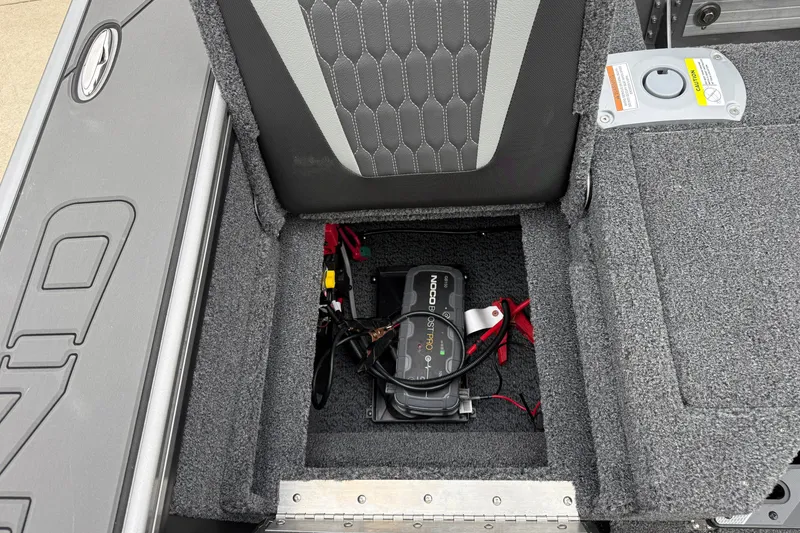 Slide: The Image of Battery compartment of 2027 Lund 1975 Pro-V boat with NOCO Genius charger. - 38