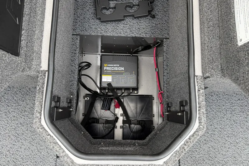 Slide: The Image of Battery compartment of 2027 Lund 1975 Pro-V boat with Minn Kota Precision charger. - 19