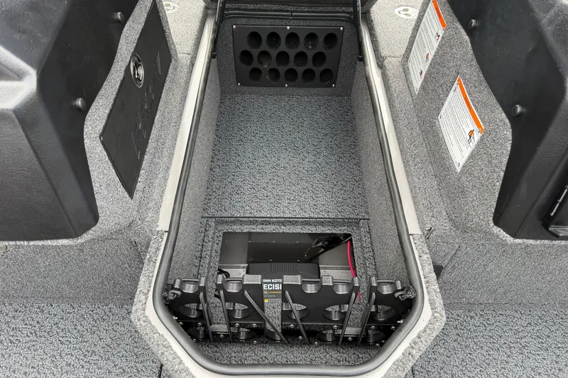 Slide: The Image of Interior view of 2027 Lund 1975 Pro-V boat storage compartment with battery. - 18