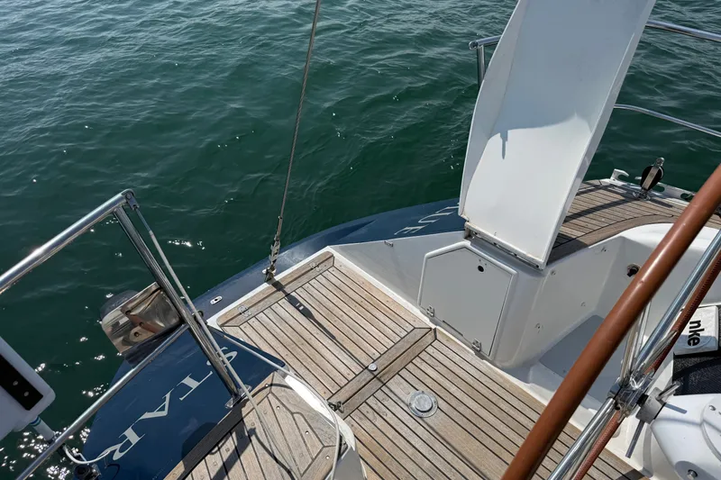 Slide: The Image of Deck of 1988 Belliure 41 yacht with wooden flooring and open hatch. - 79