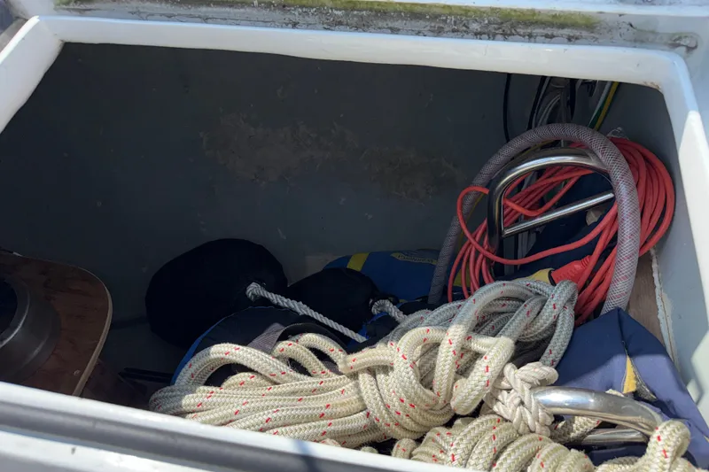 Slide: The Image of Storage compartment on a 1988 Belliure 41 boat with ropes and equipment. - 77