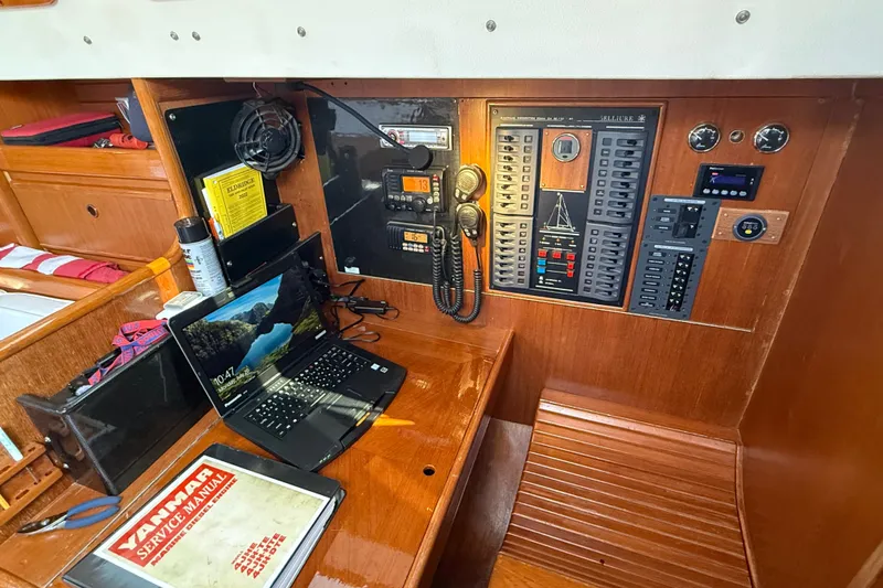 Slide: The Image of Navigation station of 1988 Belliure 41 yacht with control panel and laptop. - 25