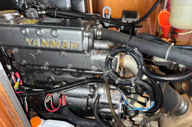 Slide: The Image of Engine compartment of a 1988 Belliure 41 yacht featuring a Yanmar engine. - 84