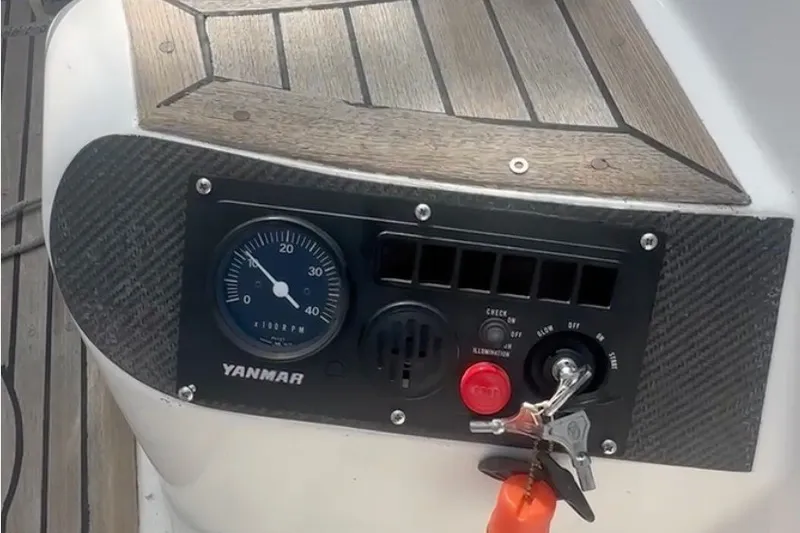 Slide: The Image of Control panel of a 1988 Belliure 41 yacht with Yanmar engine gauge and ignition keys. - 87