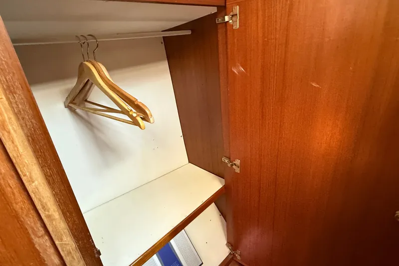 Slide: The Image of Wooden closet interior with hangers on a Belliure 41 yacht, 1988 model. - 54