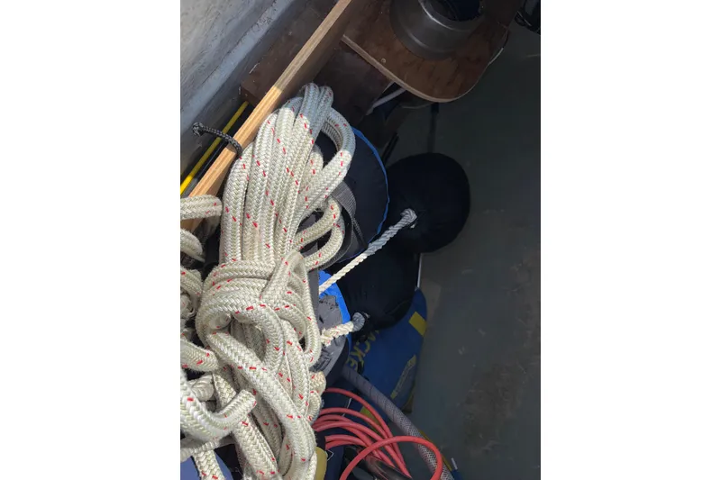 Slide: The Image of Coiled rope and equipment on a 1988 Belliure 41 sailboat deck. - 78