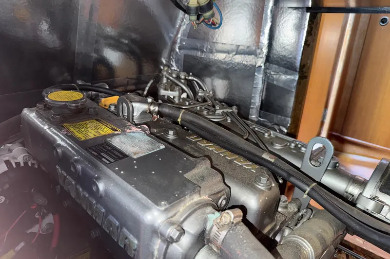 Slide: The Image of Engine compartment of a 1988 Belliure 41 yacht, featuring a Yanmar engine. - 85