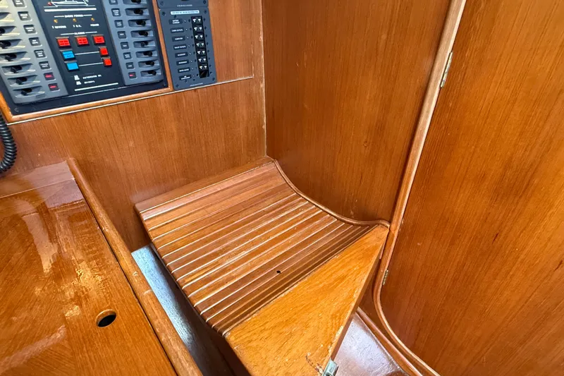 Slide: The Image of Wooden interior of 1988 Belliure 41 yacht with control panel and seating area. - 27