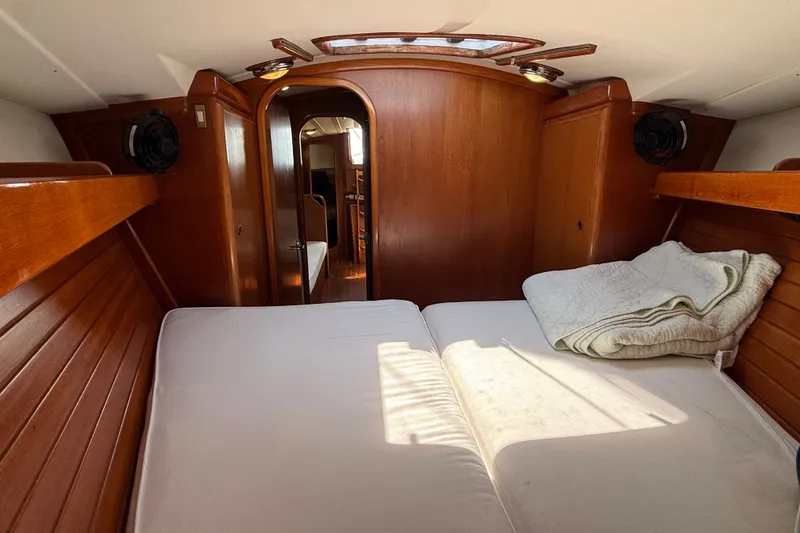 Slide: The Image of Cozy cabin interior of 1988 Belliure 41 yacht with wooden finish and bedding. - 41